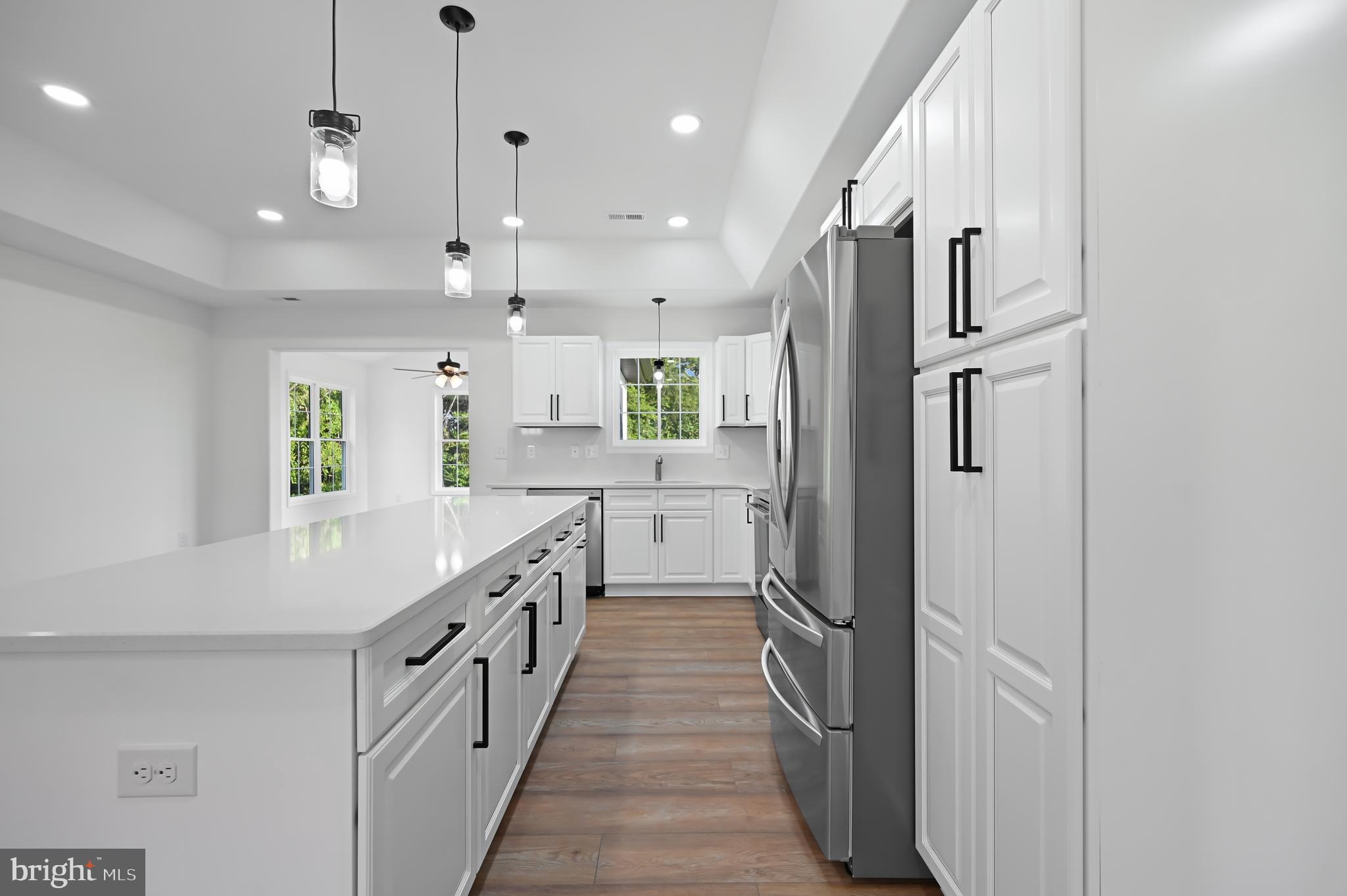 23180 Slaughter Neck Road Lincoln, DE 19960 - Photo 11 of 29 a kitchen with stainless steel appliances a refrigerator and a stove