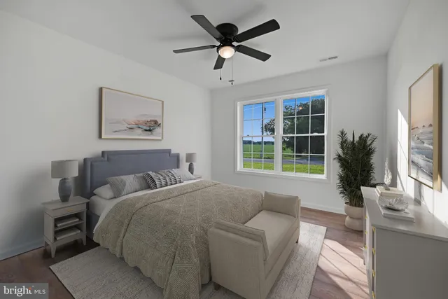 a bed room with a bed and a large window