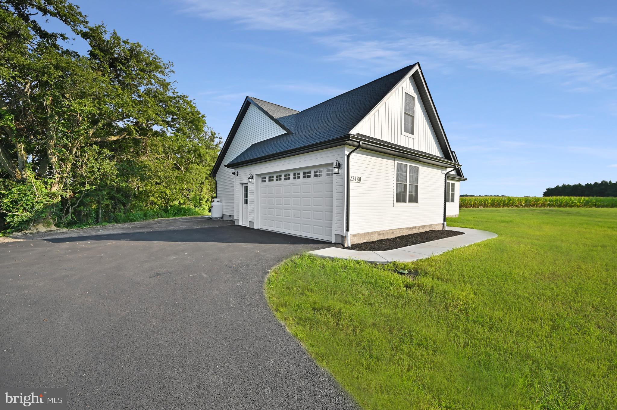 23180 Slaughter Neck Road Lincoln, DE 19960 - Photo 5 of 29 a view of a house with a yard