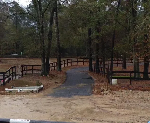 a view of a park with wooden bench