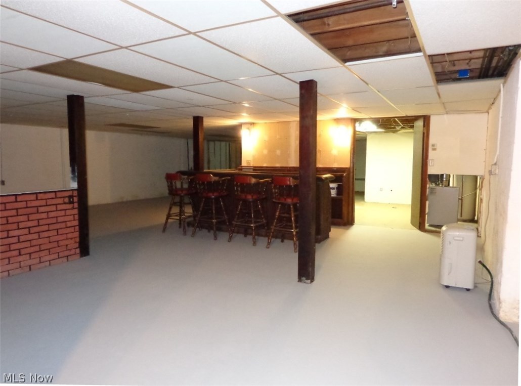 11167 Robson Road Grafton, OH 44044 - Photo 29 of 33 HUGE Basement! The 4 stool bar has a wet bar/sink as well. The floor was just painted in April, 2017