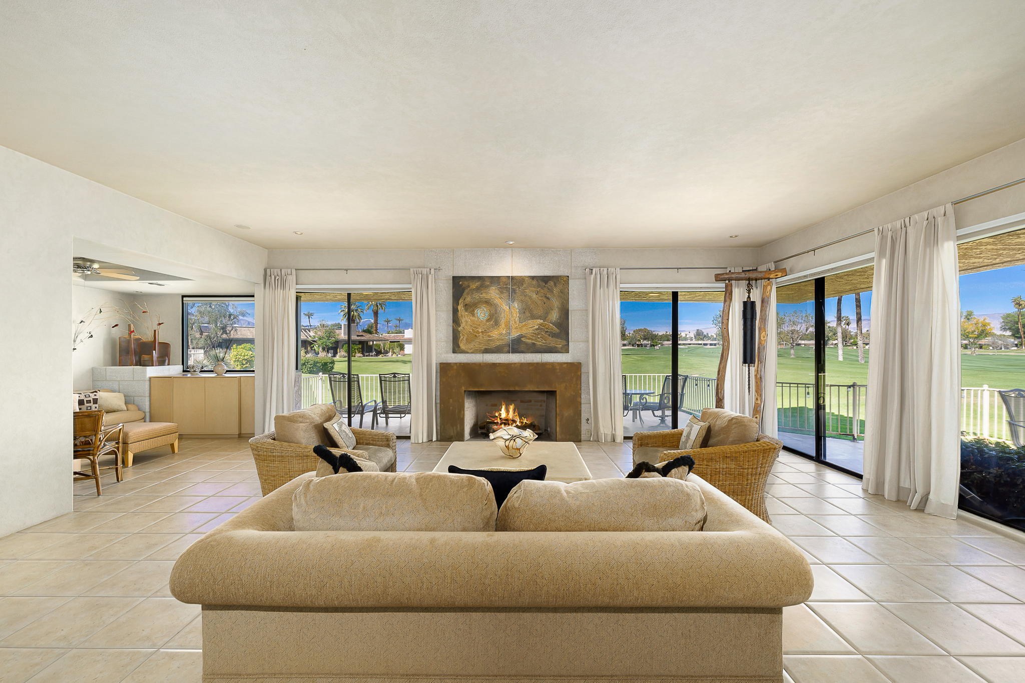 74 Colgate Drive Rancho Mirage, CA 92270 - Photo 3 of 38 a living room with furniture and large windows