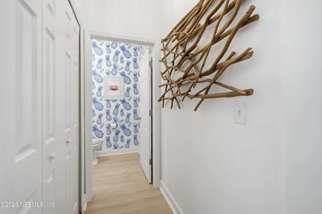 a spacious bathroom with a granite countertop sink a mirror and a shower