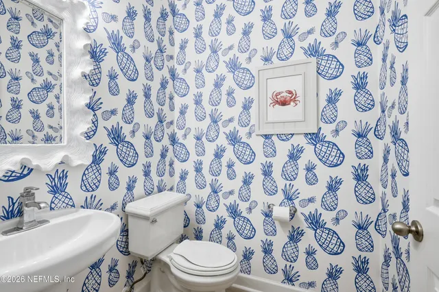 a workspace with wooden floor and a window