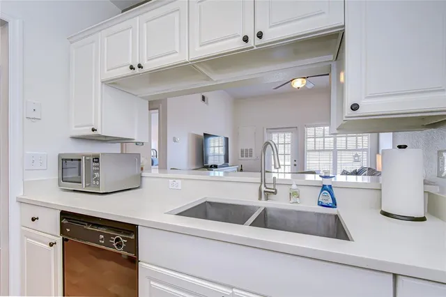 a living room with furniture a rug and a window