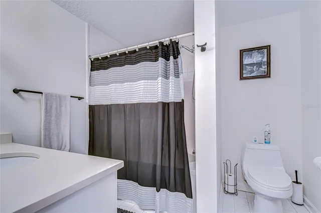 a view of a house with wooden fence