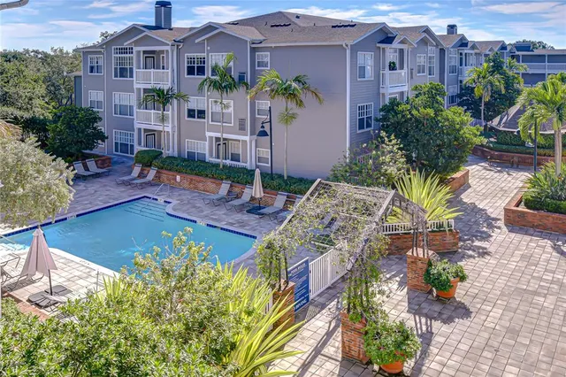 a aerial view of a house with a yard and garden