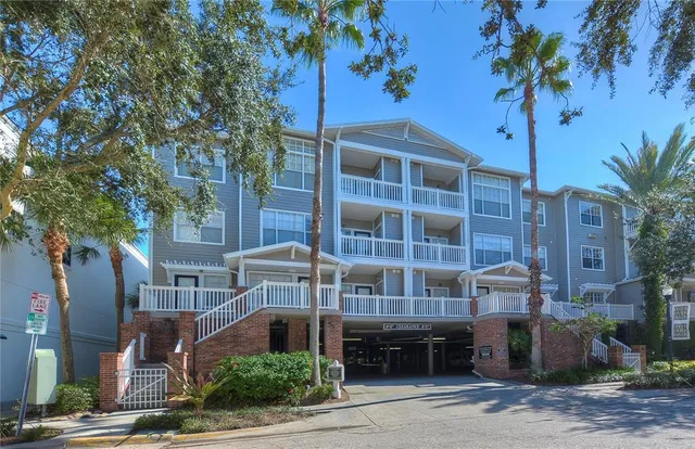 a view of parking garage with cars