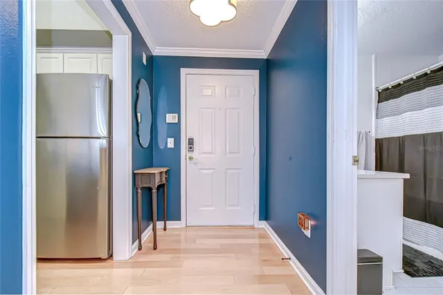 a dining room with kitchen island a table and chairs