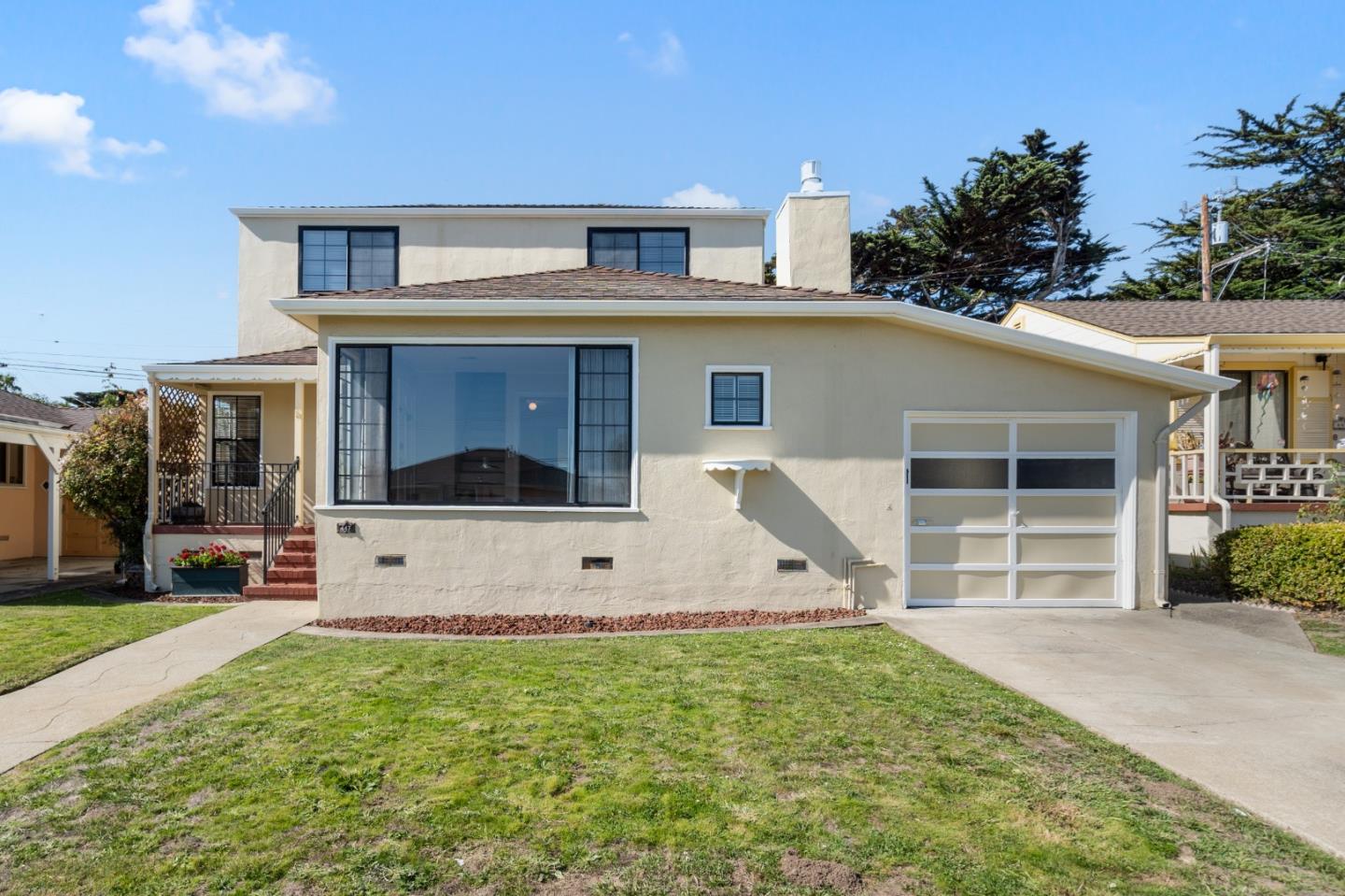 447 Briarwood Drive South San Francisco, CA 94080 - Photo 1 of 25 a front view of a house with a yard and garage