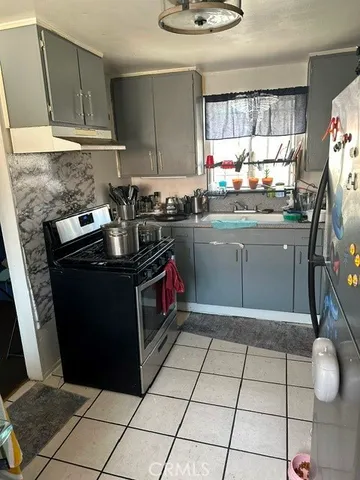 a kitchen with a cabinets and window