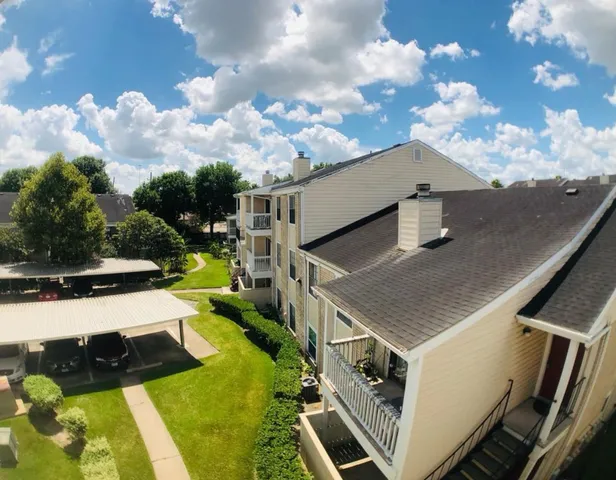 a view of a balcony with sitting area