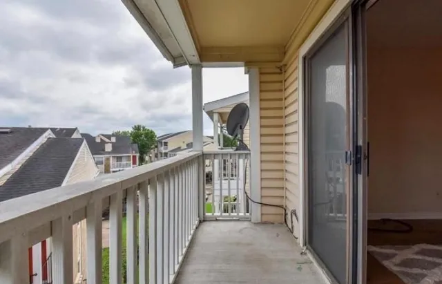 a view of a balcony with an outdoor space
