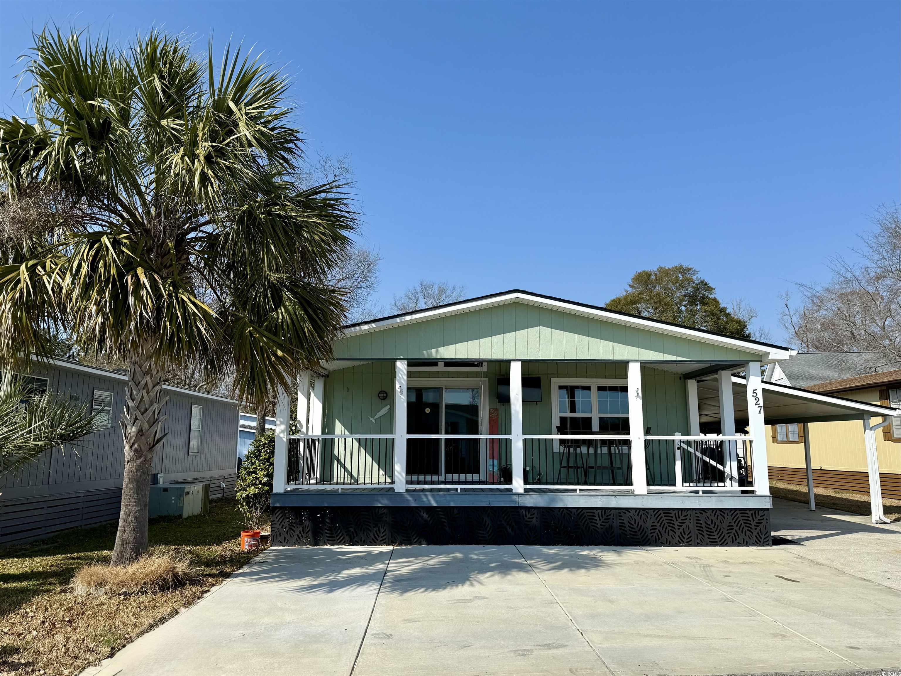 527 Sandpebble Surfside Beach, SC 29575 - Photo 1 of 31 View of front of house featuring a carport and cov