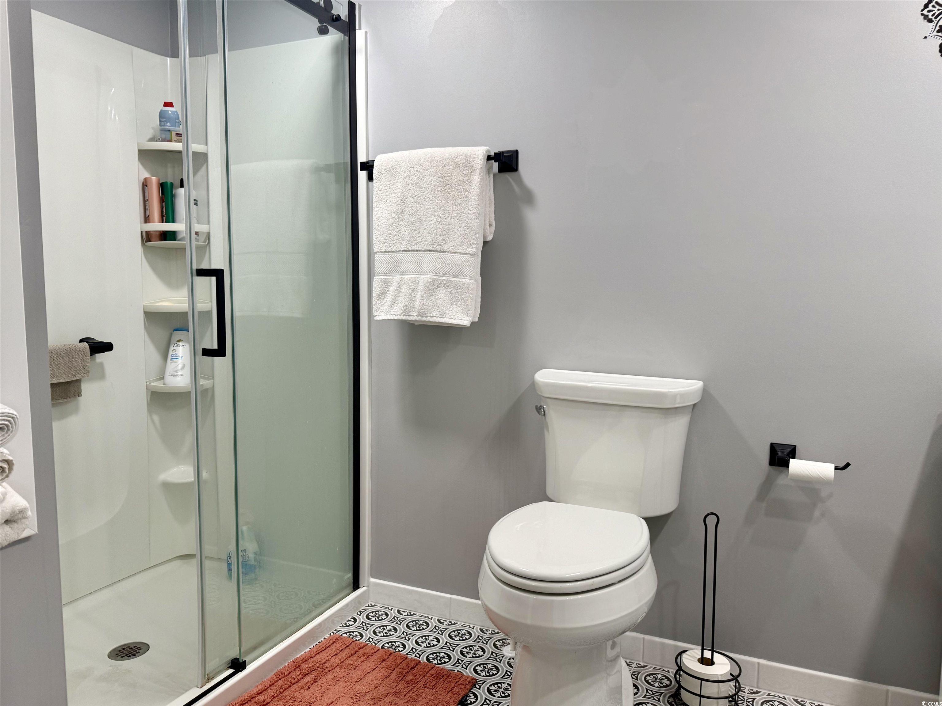527 Sandpebble Surfside Beach, SC 29575 - Photo 11 of 31 Bathroom featuring tile patterned floors, toilet,