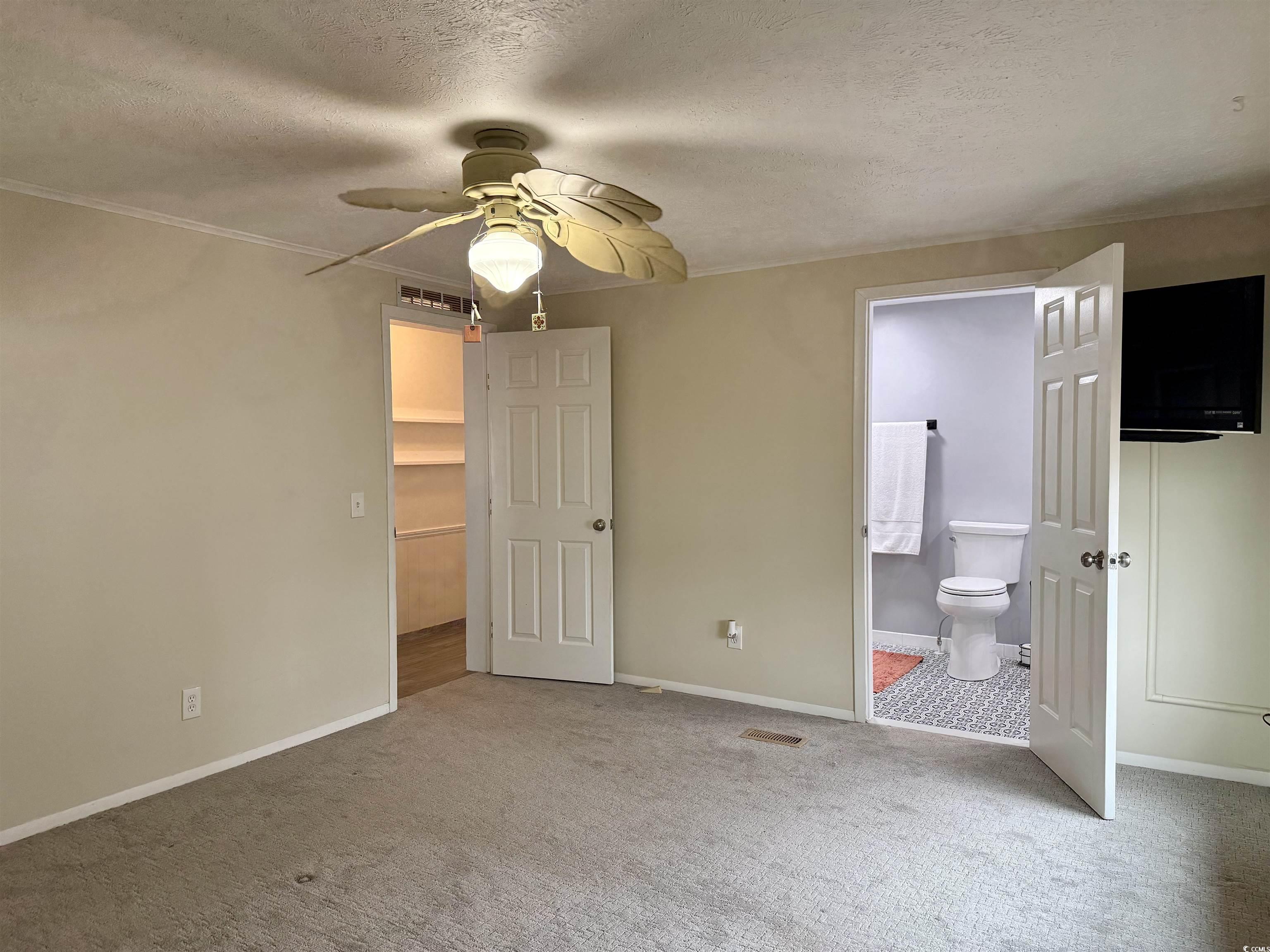 527 Sandpebble Surfside Beach, SC 29575 - Photo 14 of 31 Unfurnished bedroom featuring ensuite bathroom, ca