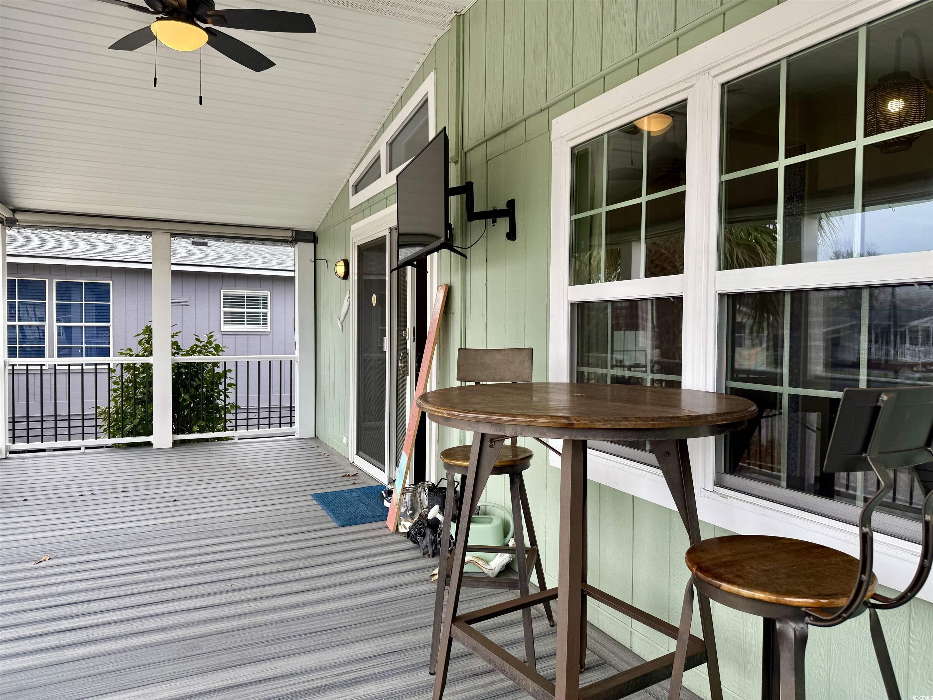 527 Sandpebble Surfside Beach, SC 29575 - Photo 2 of 31 Wooden deck with ceiling fan