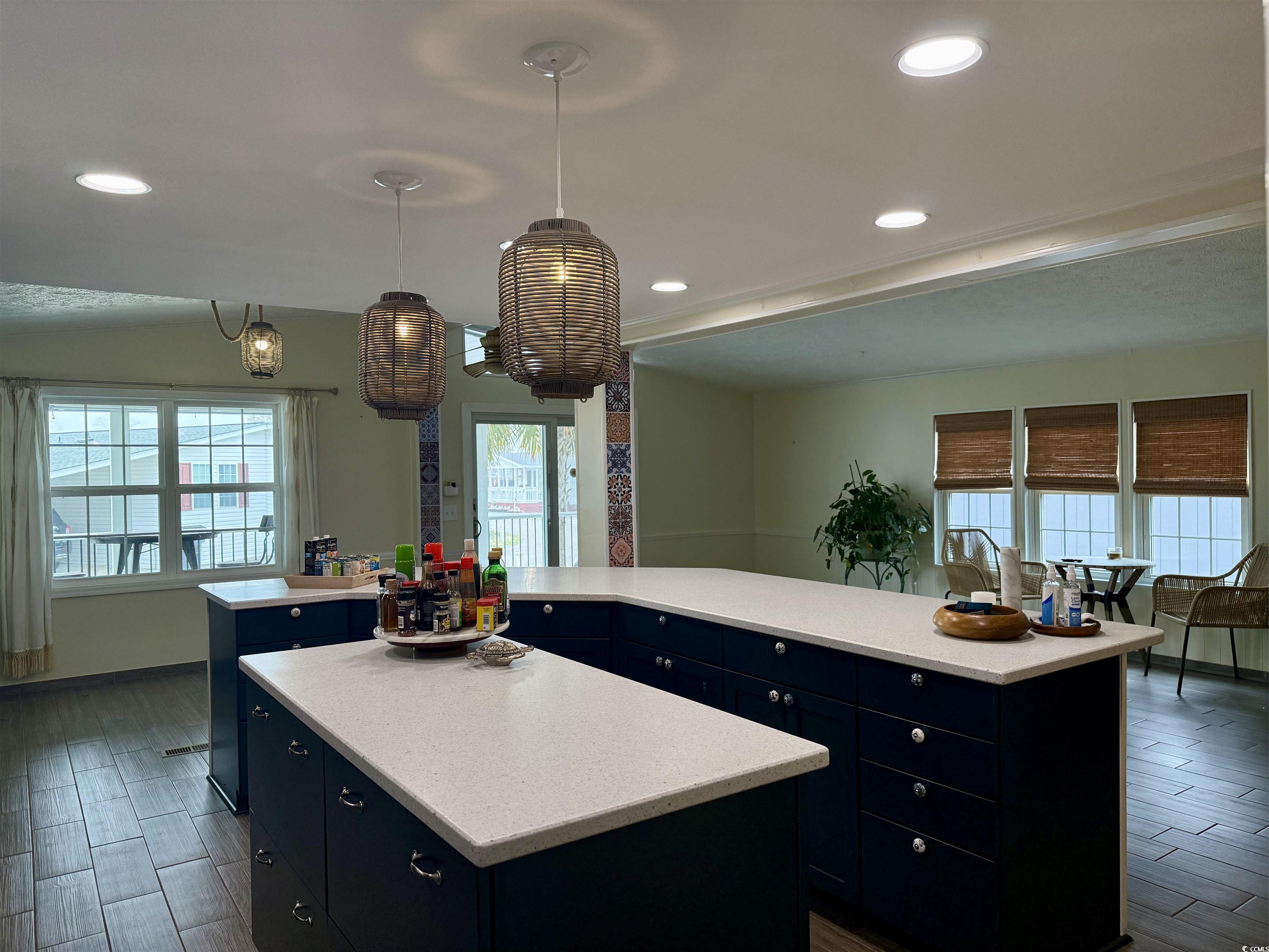 527 Sandpebble Surfside Beach, SC 29575 - Photo 21 of 31 Kitchen with pendant lighting, blue cabinetry, and