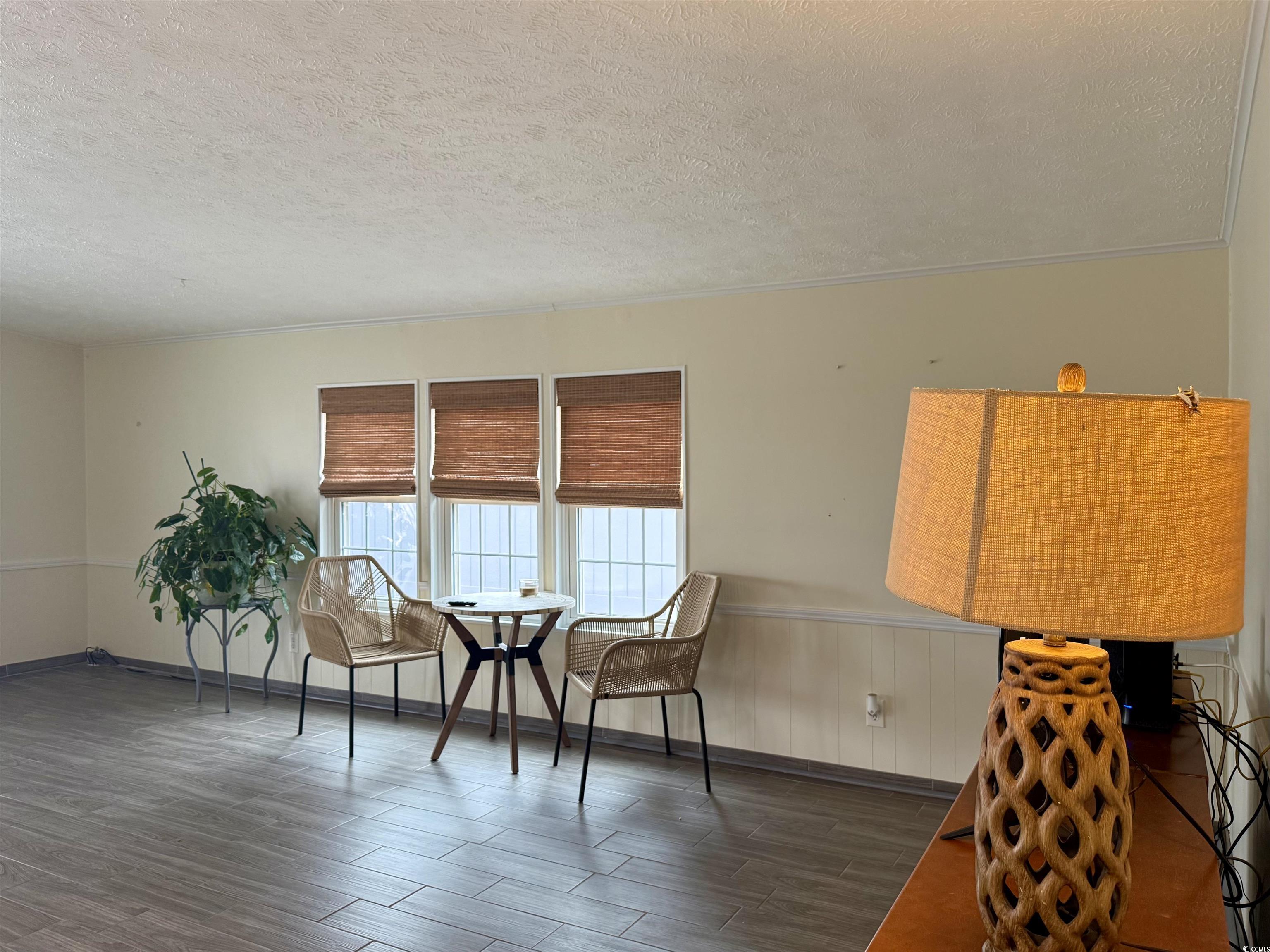 527 Sandpebble Surfside Beach, SC 29575 - Photo 22 of 31 Dining space with dark wood-type flooring and a te