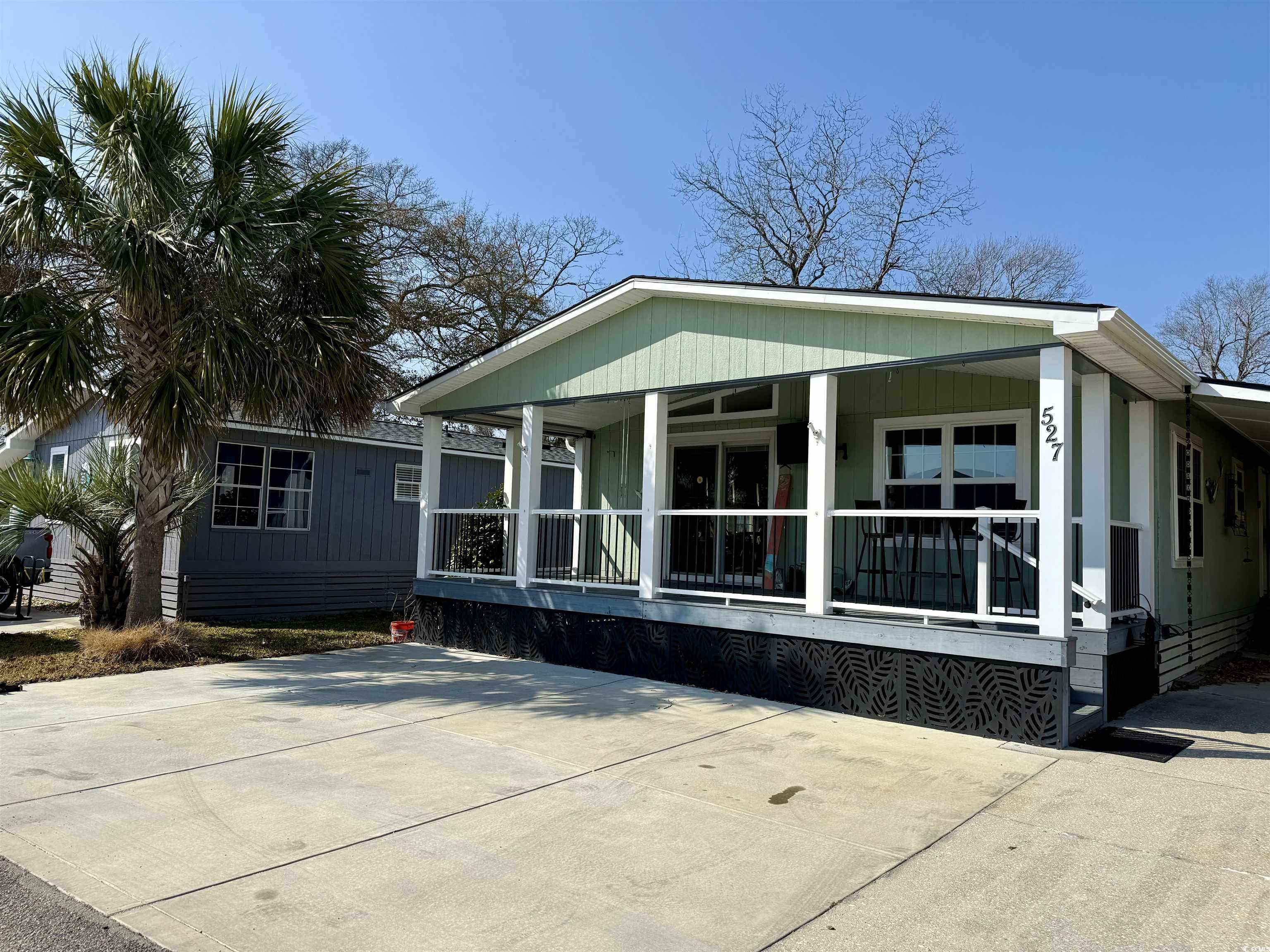 527 Sandpebble Surfside Beach, SC 29575 - Photo 26 of 31 Exterior space with covered porch
