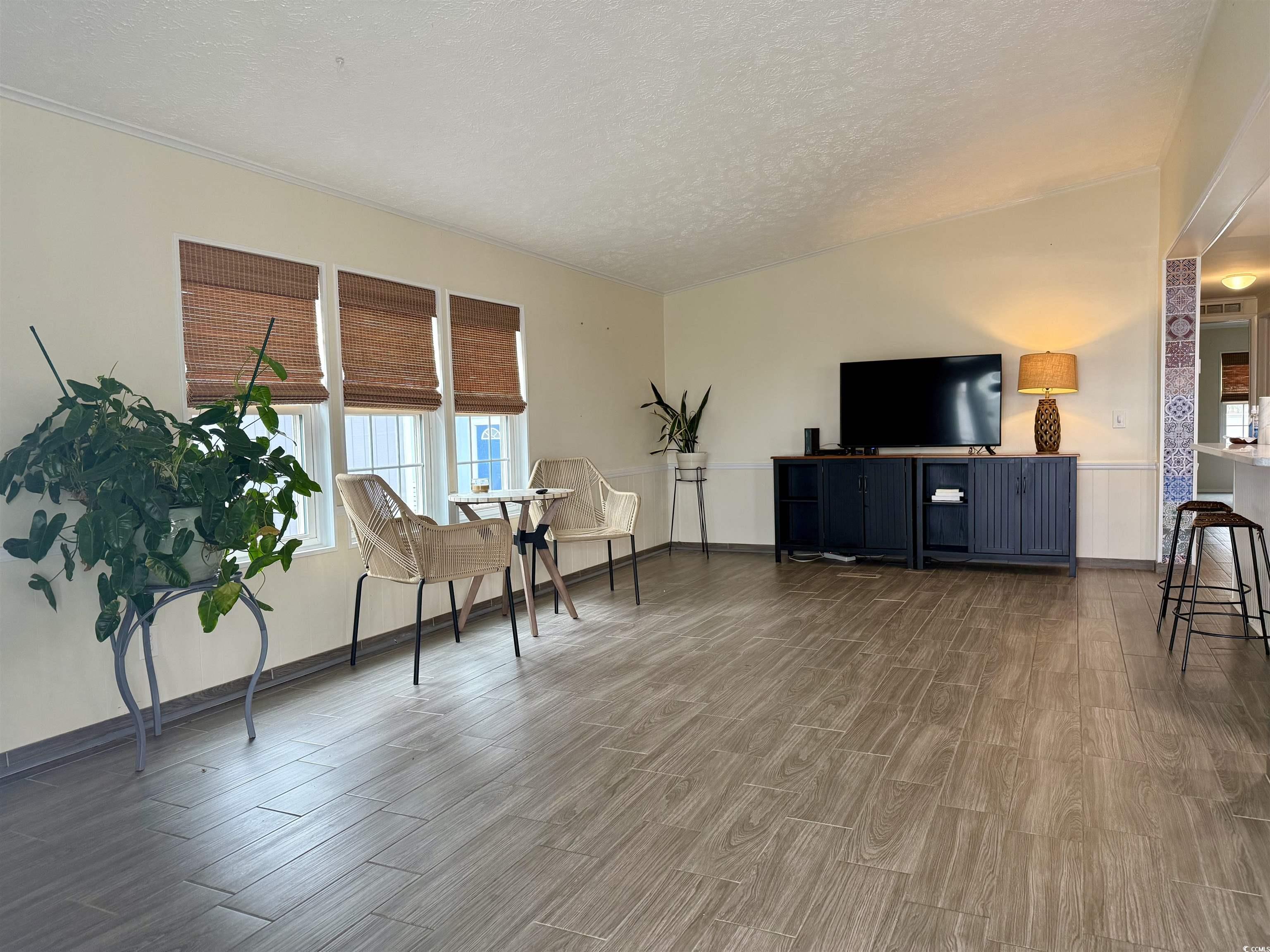 527 Sandpebble Surfside Beach, SC 29575 - Photo 5 of 31 Sitting room featuring wood-type flooring and a te