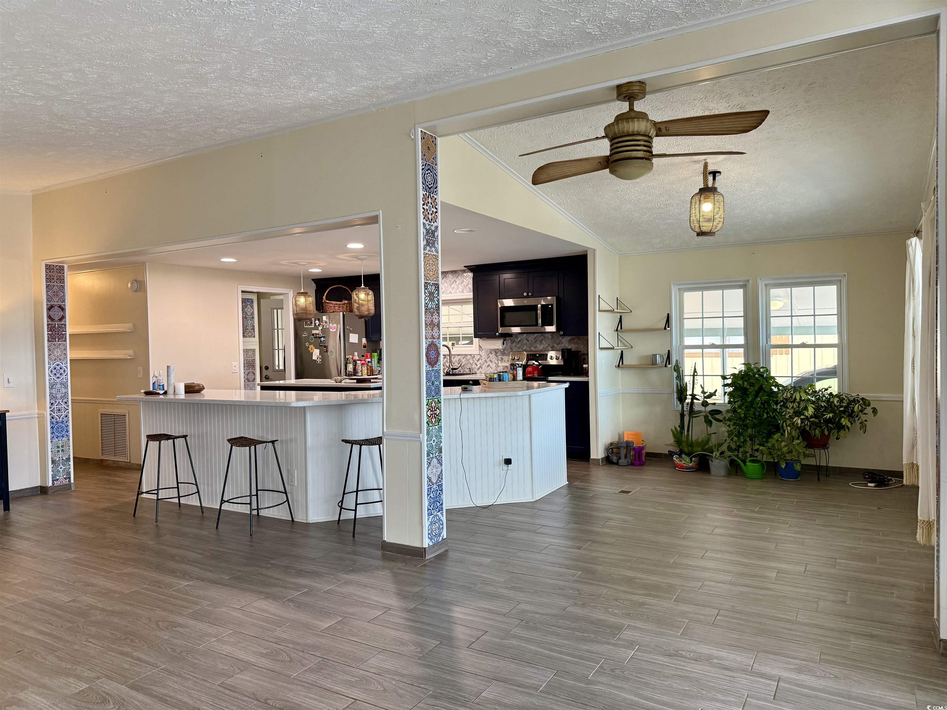 527 Sandpebble Surfside Beach, SC 29575 - Photo 6 of 31 Kitchen featuring a textured ceiling, appliances w