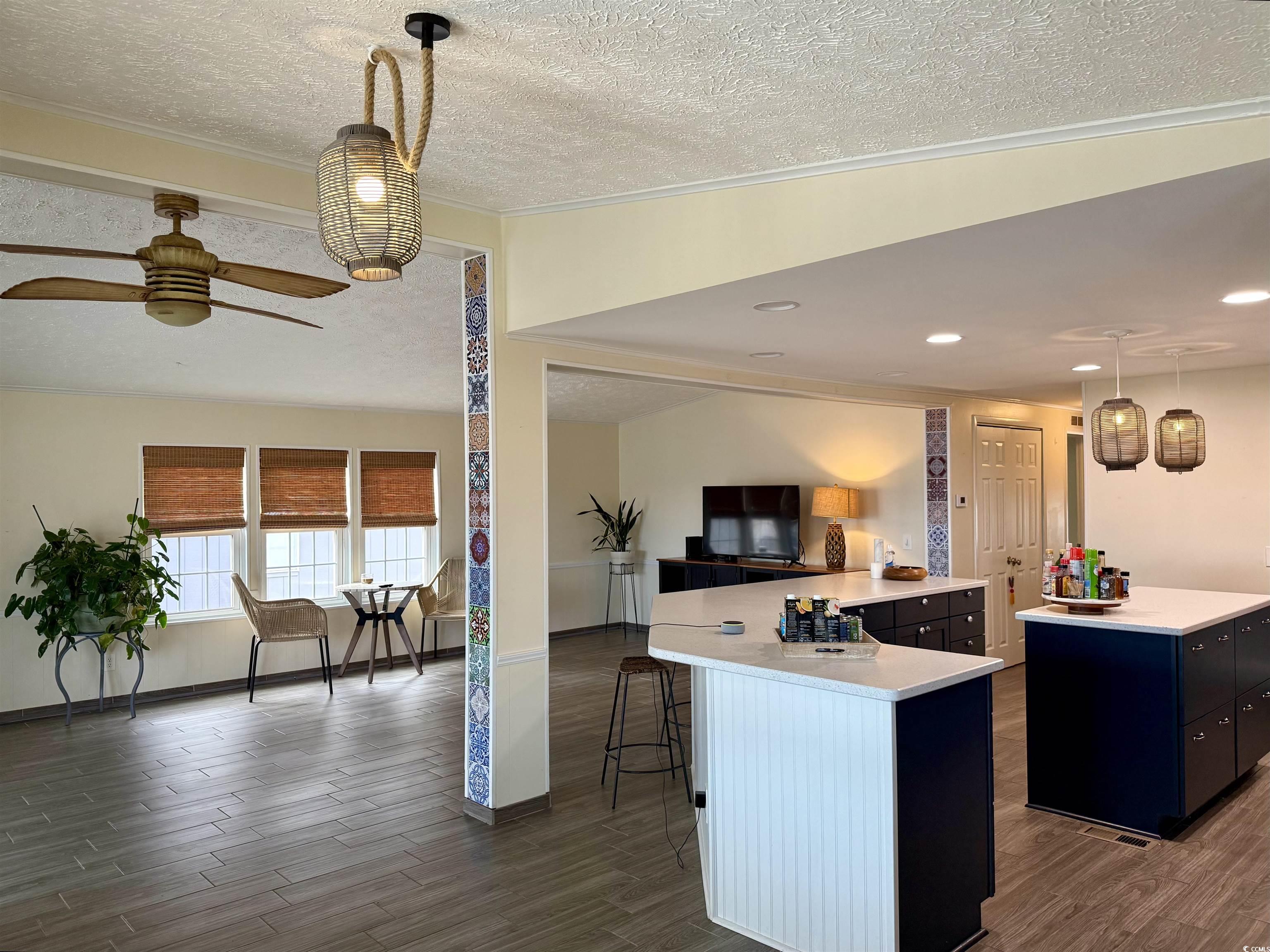 527 Sandpebble Surfside Beach, SC 29575 - Photo 8 of 31 Kitchen with a breakfast bar, a center island, a t