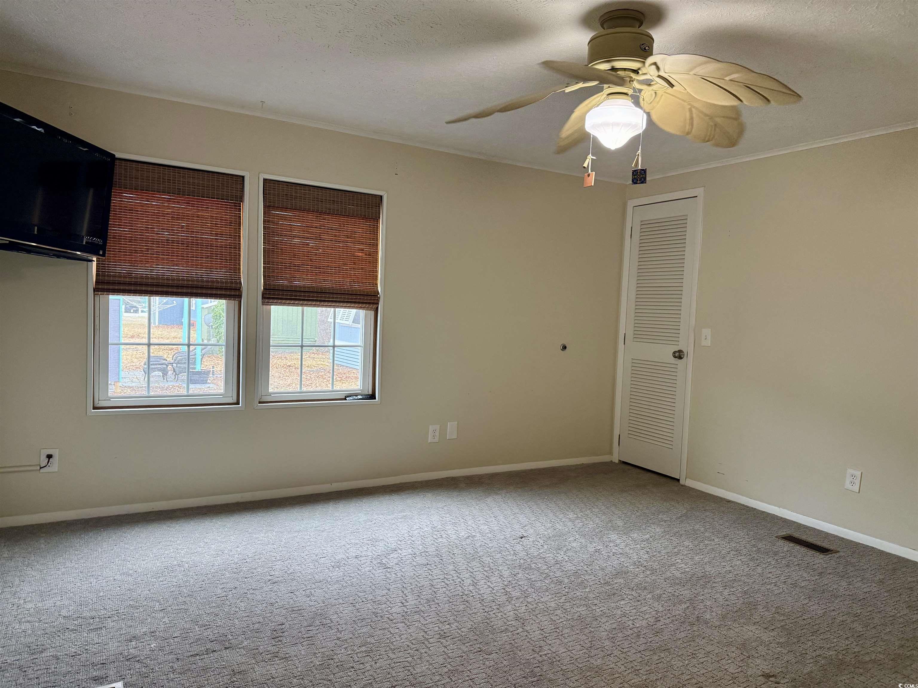 527 Sandpebble Surfside Beach, SC 29575 - Photo 10 of 31 Carpeted empty room featuring a textured ceiling,