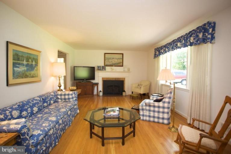 2057 Rockingham Street McLean, VA 22101 - Photo 14 of 14 a living room with furniture a window and a fireplace