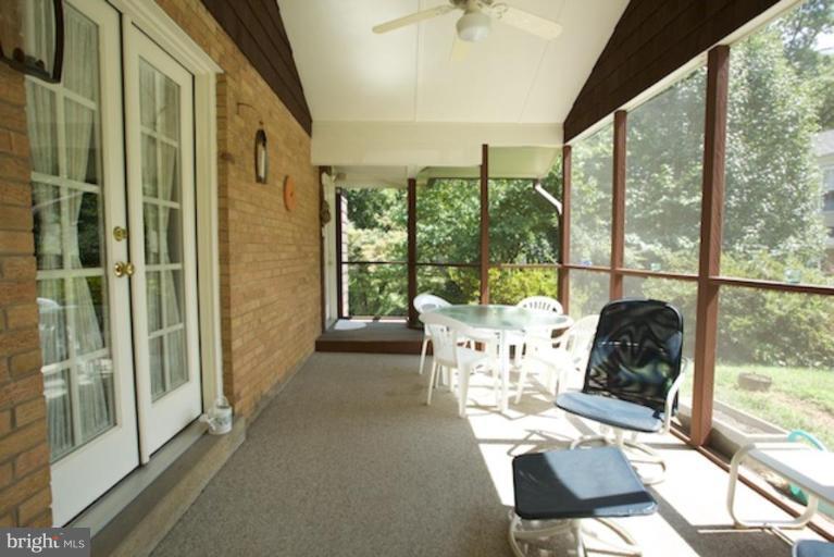 2057 Rockingham Street McLean, VA 22101 - Photo 4 of 14 a living room with furniture and a floor to ceiling window