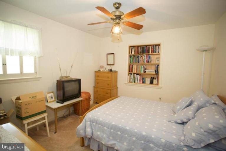 2057 Rockingham Street McLean, VA 22101 - Photo 7 of 14 a bedroom with a bed desk and chair