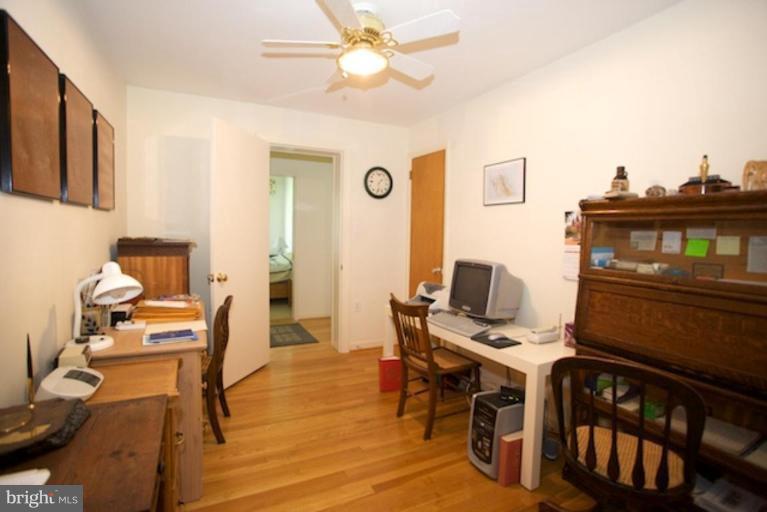 2057 Rockingham Street McLean, VA 22101 - Photo 8 of 14 a view of a workspace with furniture and wooden floor