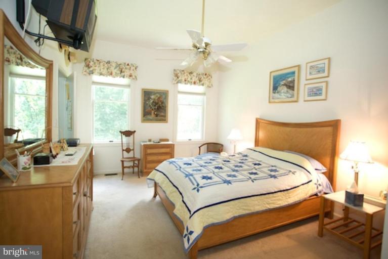 2057 Rockingham Street McLean, VA 22101 - Photo 10 of 14 a bedroom with a bed a dresser with wooden floor