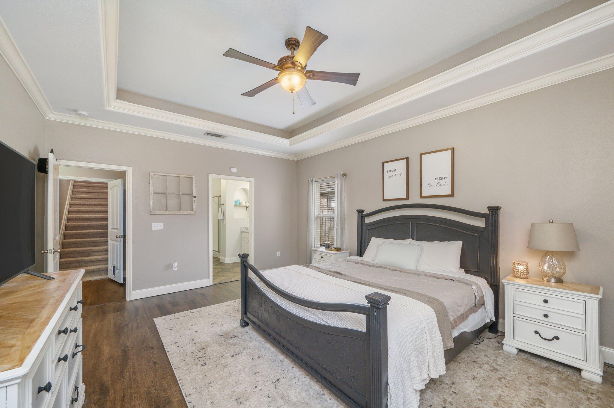 4545 Hermosa Road Crestview, FL 32539 - Photo 13 of 36 a bedroom with a large bed and a chandelier