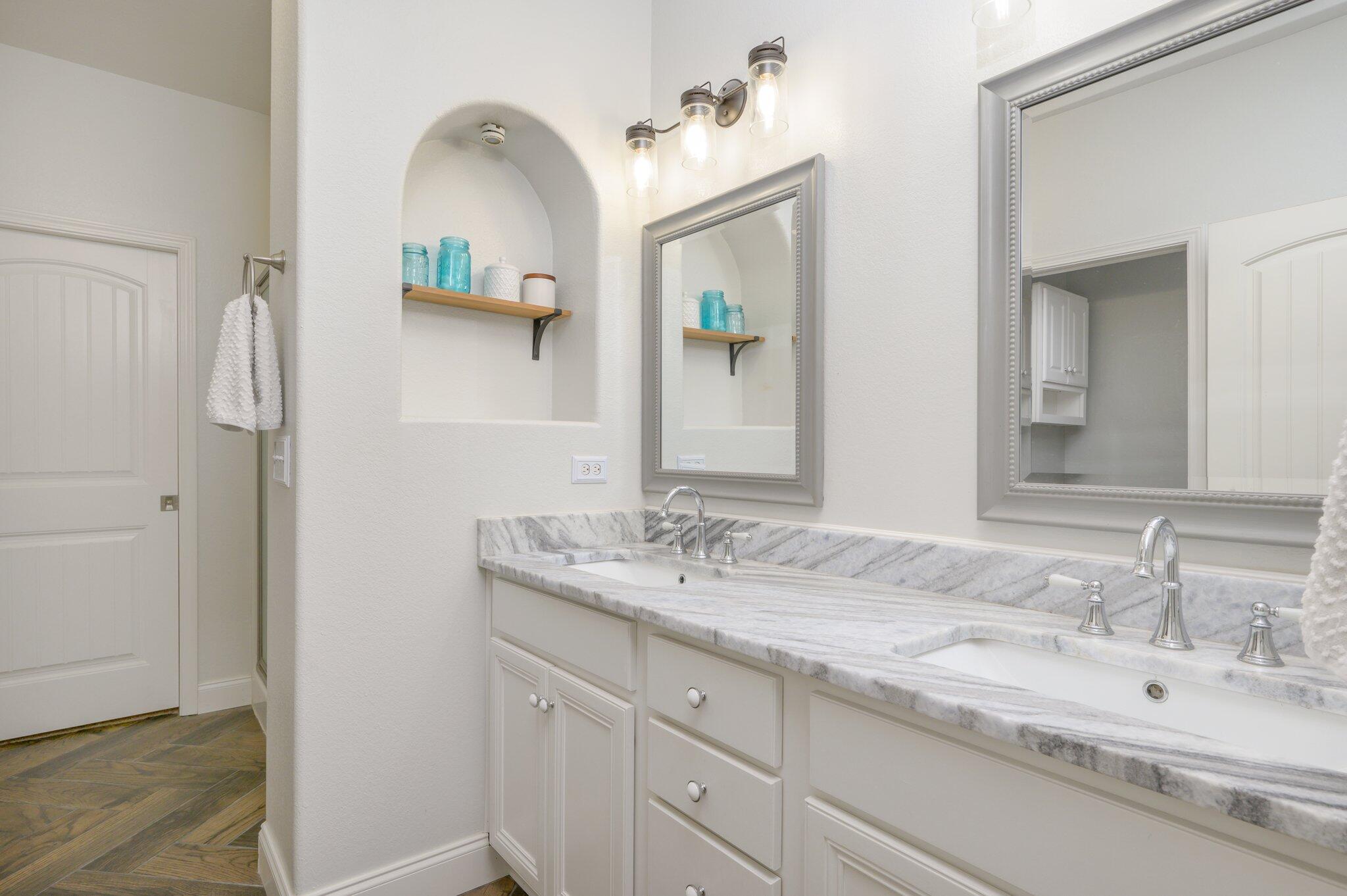 4545 Hermosa Road Crestview, FL 32539 - Photo 14 of 36 a bathroom with a granite countertop sink and a mirror