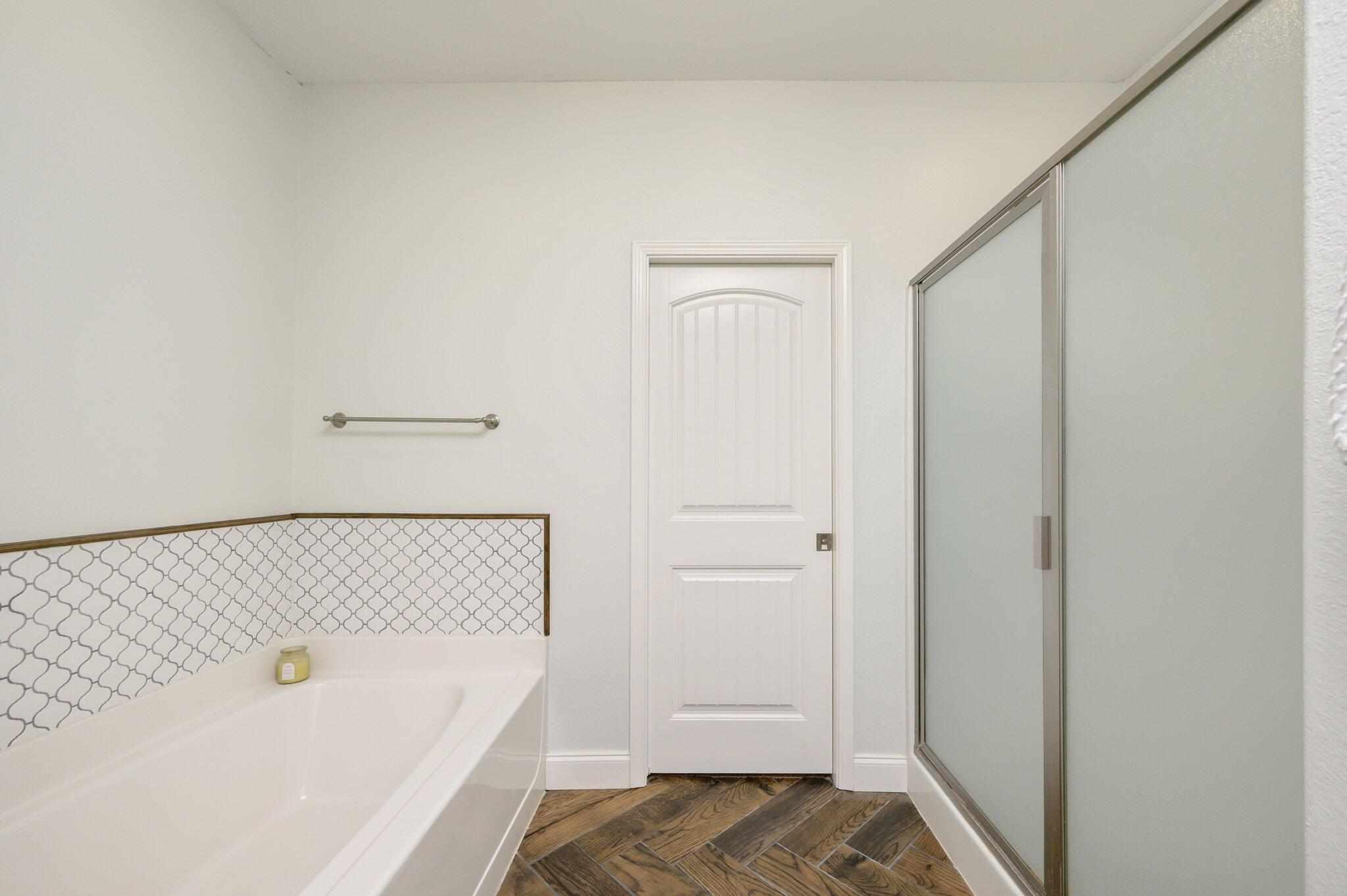 4545 Hermosa Road Crestview, FL 32539 - Photo 15 of 36 a bathroom with a bathtub and a shower
