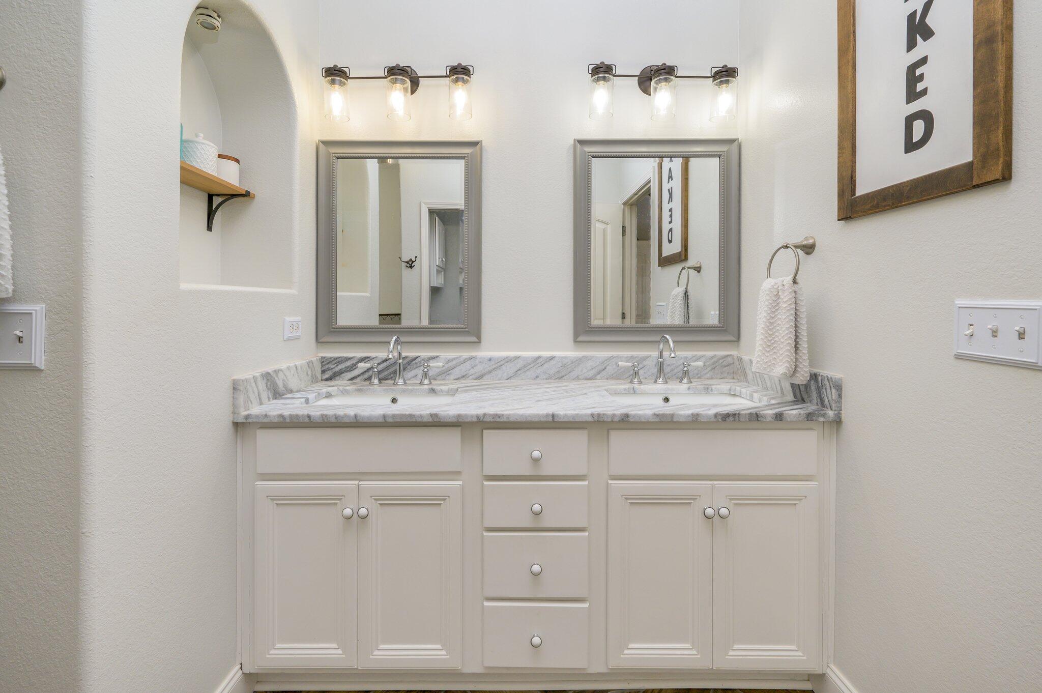 4545 Hermosa Road Crestview, FL 32539 - Photo 17 of 36 a bathroom with a granite countertop sink and a mirror