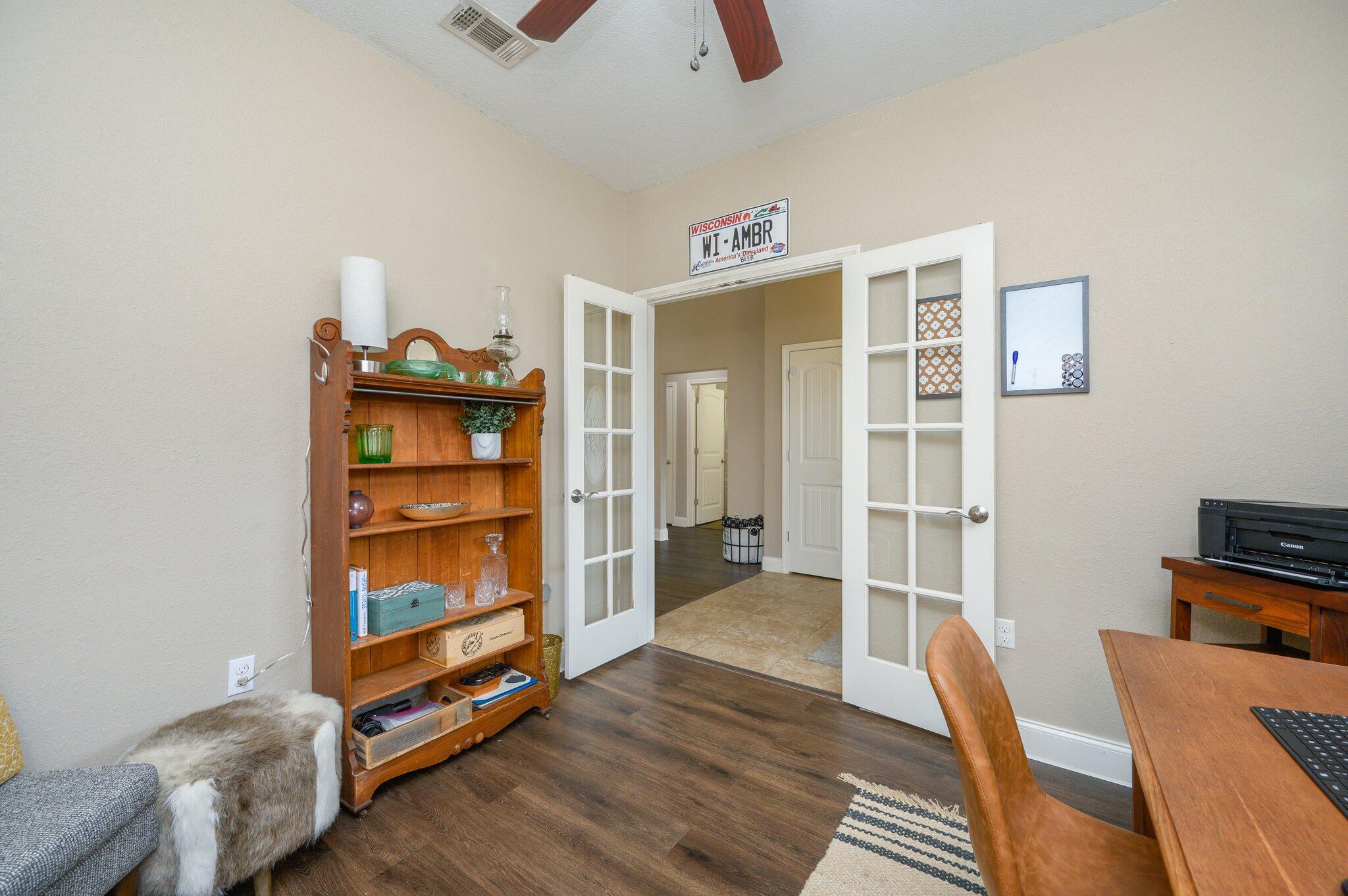 4545 Hermosa Road Crestview, FL 32539 - Photo 19 of 36 a view of workspace with wooden floor and bedroom