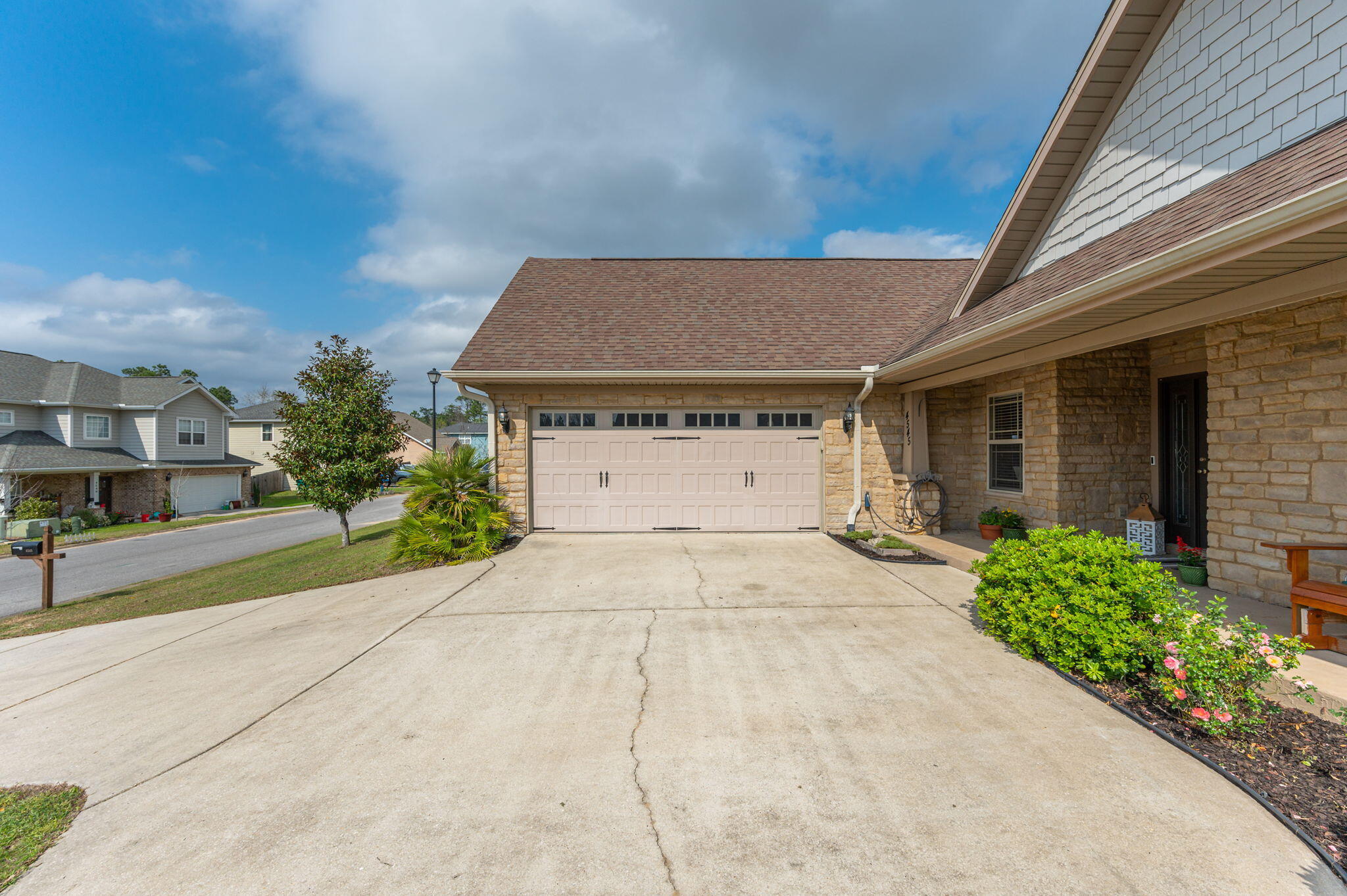 4545 Hermosa Road Crestview, FL 32539 - Photo 2 of 36 a house with a yard and a garage