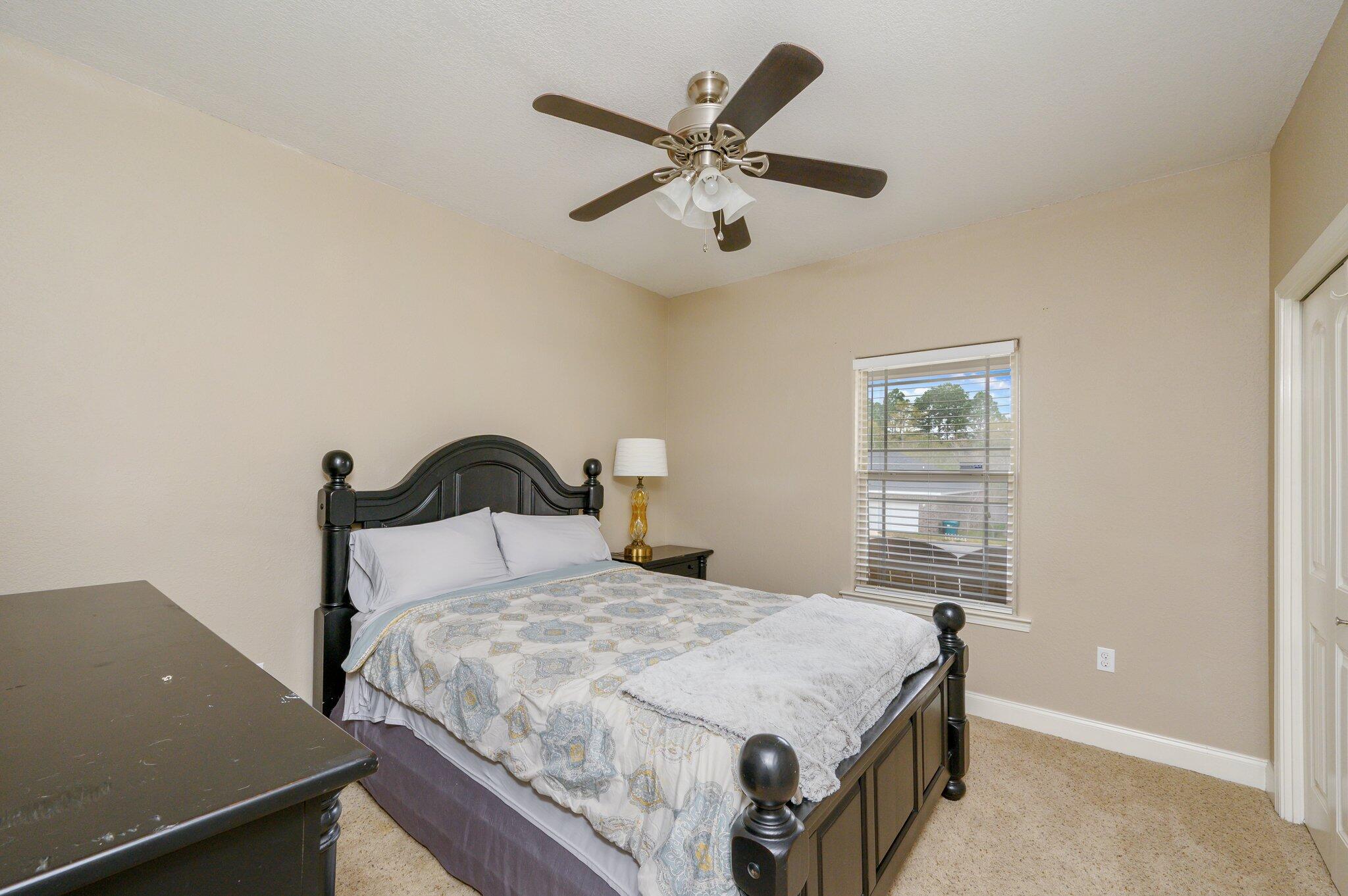 4545 Hermosa Road Crestview, FL 32539 - Photo 21 of 36 a bedroom with a bed and window