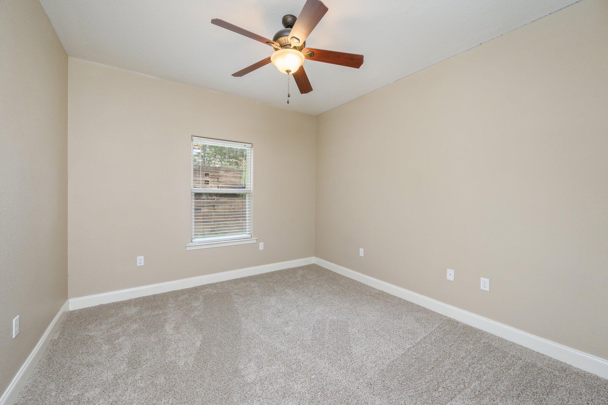 4545 Hermosa Road Crestview, FL 32539 - Photo 22 of 36 an empty room with a window and a fan
