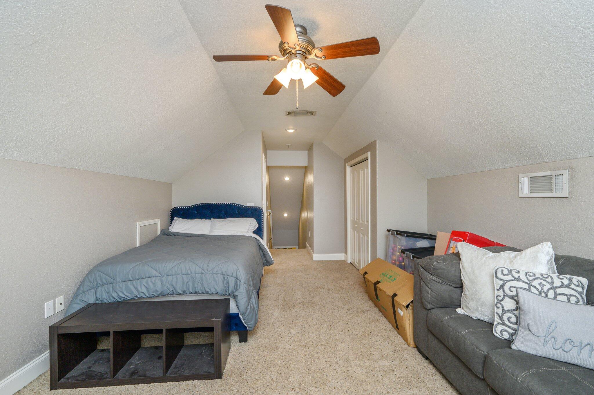 4545 Hermosa Road Crestview, FL 32539 - Photo 28 of 36 a living room with furniture and a chandelier