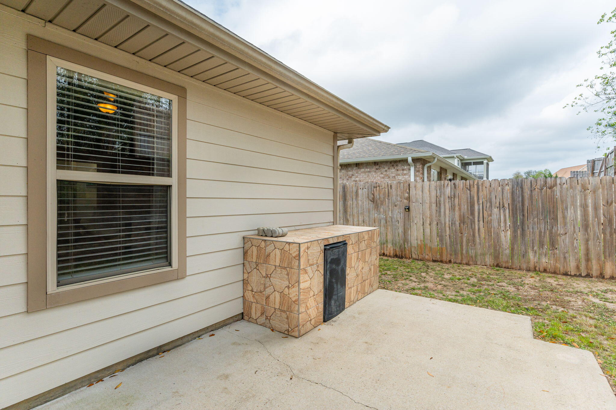 4545 Hermosa Road Crestview, FL 32539 - Photo 33 of 36 a view of backyard with wooden fence