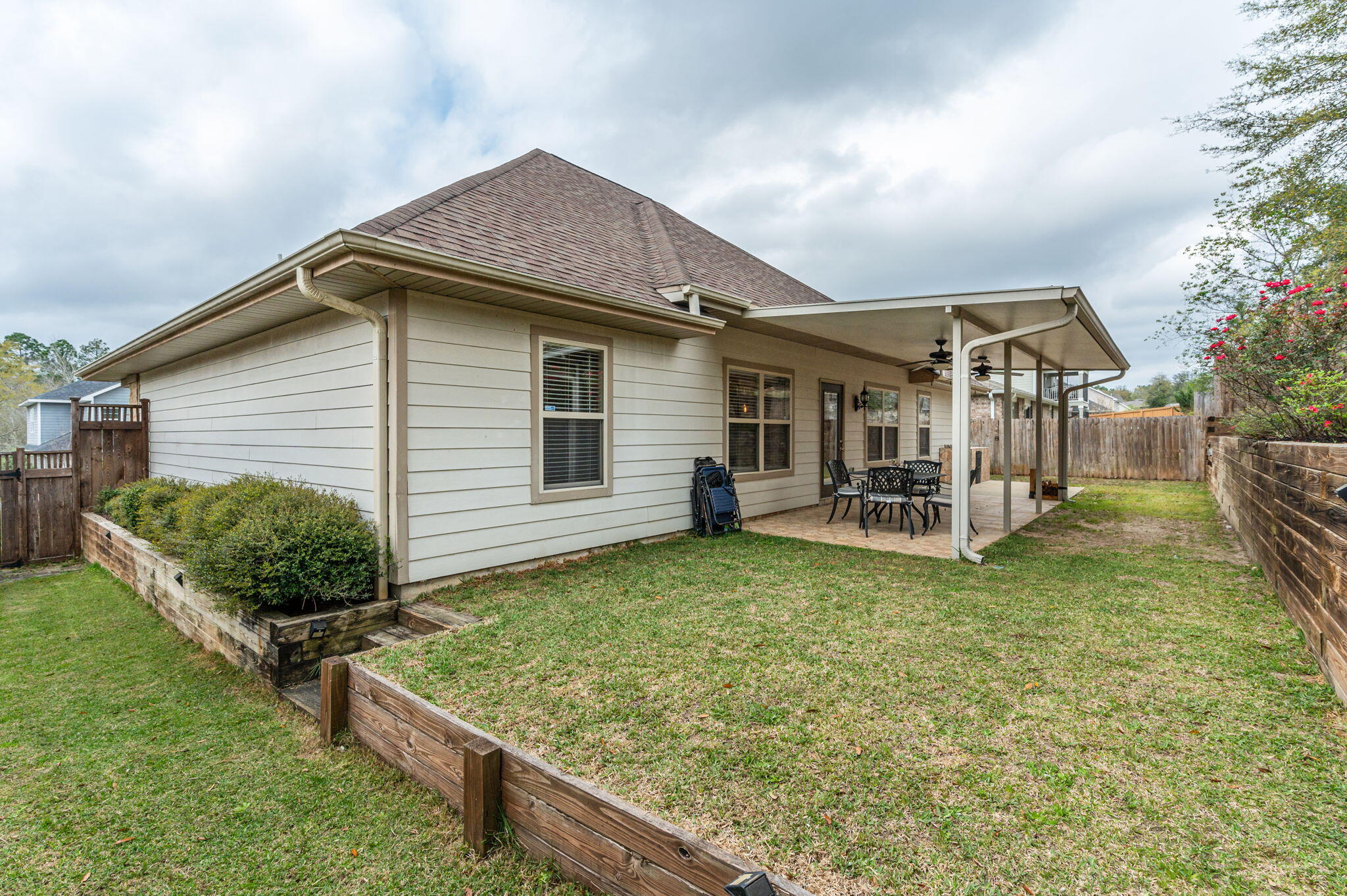 4545 Hermosa Road Crestview, FL 32539 - Photo 35 of 36 a view of a house with backyard porch and sitting area