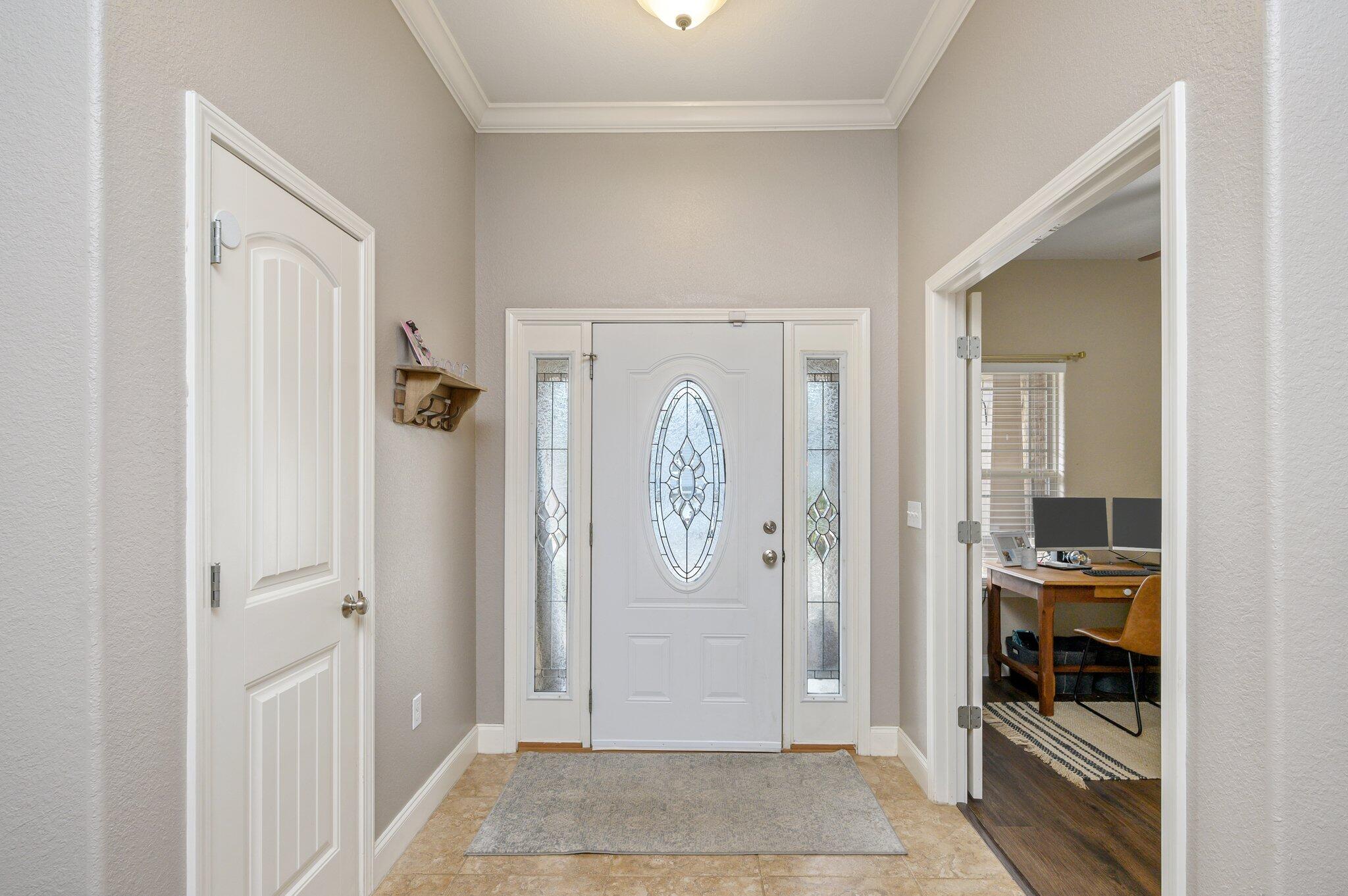 4545 Hermosa Road Crestview, FL 32539 - Photo 5 of 36 a view of a livingroom with bathroom and front door