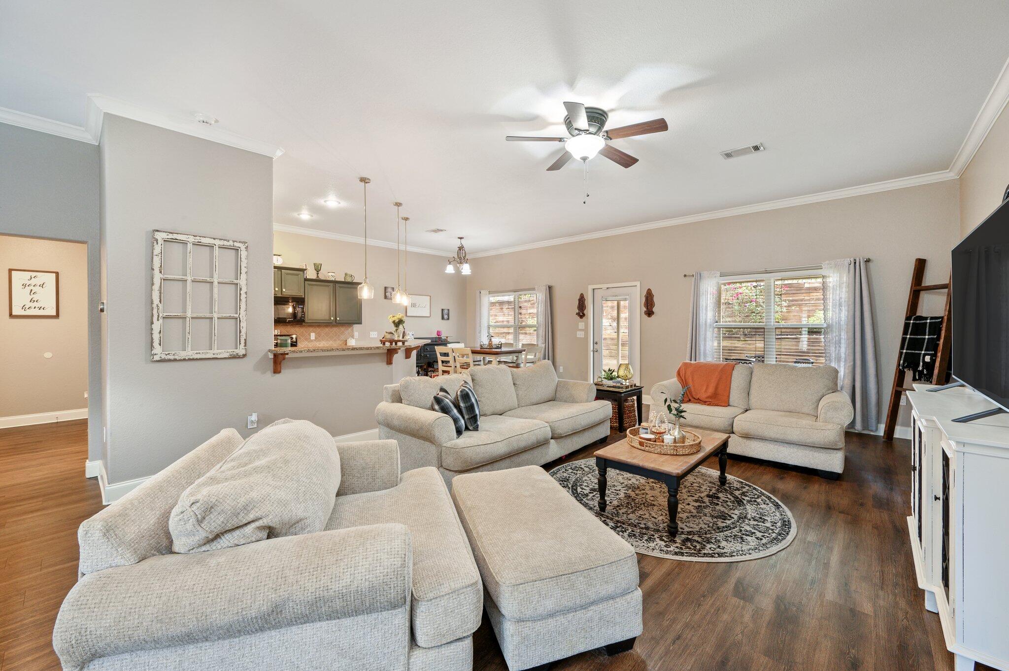 4545 Hermosa Road Crestview, FL 32539 - Photo 6 of 36 a living room with furniture kitchen view and a flat screen tv