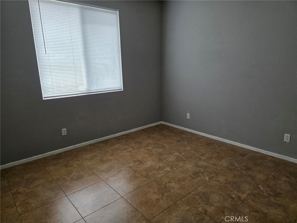 13491 Falcon Ridge Road Eastvale, CA 92880 - Photo 17 of 45 1st floor bedroom