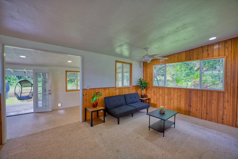 73 Canney Road Mountain View, HI 96771 - Photo 12 of 30 a living room with furniture and a large window