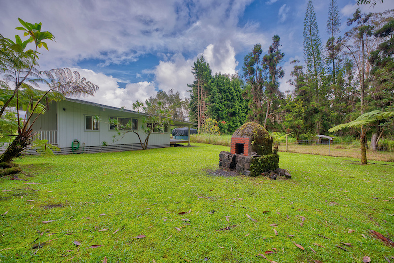 73 Canney Road Mountain View, HI 96771 - Photo 3 of 30 a view of a backyard with garden and entertaining space