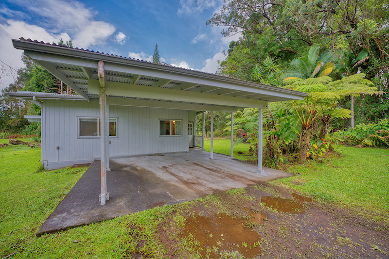 73 Canney Road Mountain View, HI 96771 - Photo 9 of 30 a view of a backyard with plants and large trees
